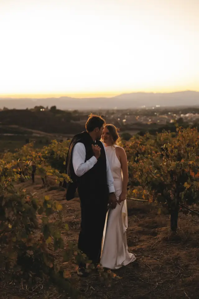 Newlyweds overlooking the Temecula valley at sunset